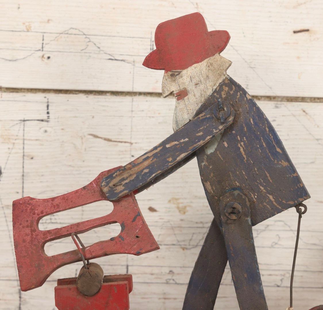 Lot 018 - Antique Hand Painted Wooden Folk Art Whirligig With Man Sawing Log, Missing Two Propeller Blades, 15-1/4" L