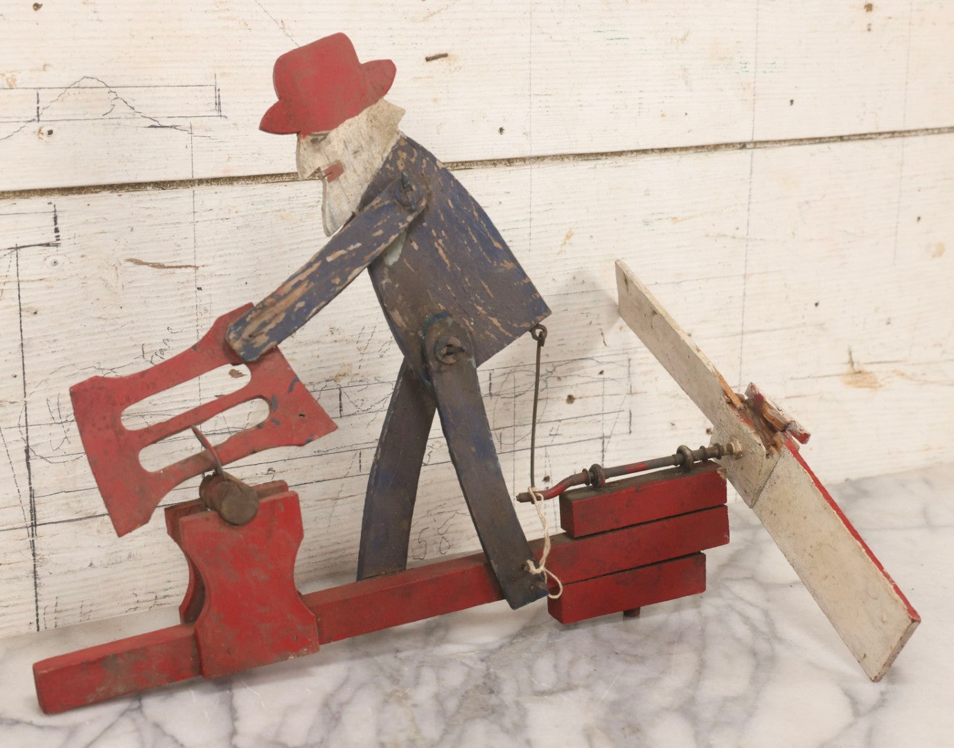 Lot 018 - Antique Hand Painted Wooden Folk Art Whirligig With Man Sawing Log, Missing Two Propeller Blades, 15-1/4" L