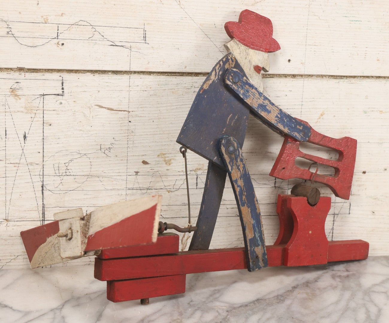 Lot 018 - Antique Hand Painted Wooden Folk Art Whirligig With Man Sawing Log, Missing Two Propeller Blades, 15-1/4" L