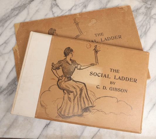 Lot 032 - “The Social Ladder” Antique Illustrated Book By Charles Dana Gibson, Published By R.H. Russell, New York, And John Lane, London, 1902, With Partial Original Presentation Sleeve