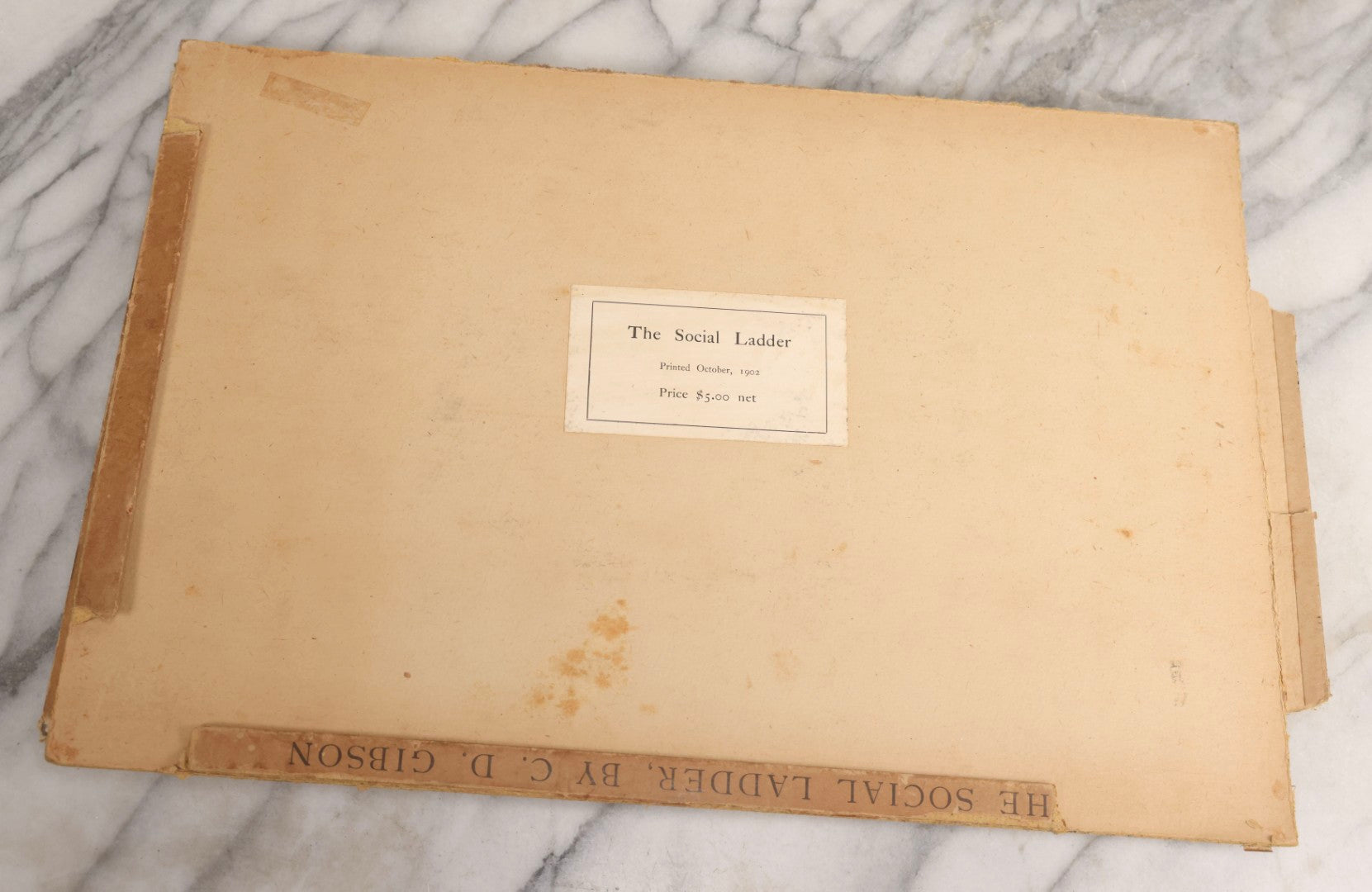 Lot 032 - “The Social Ladder” Antique Illustrated Book By Charles Dana Gibson, Published By R.H. Russell, New York, And John Lane, London, 1902, With Partial Original Presentation Sleeve