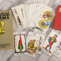 Lot 034 - Pair Of Vintage Tarot Items Including J. Muller & Cie French Marseille-Style Tarot Deck Of 78 Cards With Red Slip Case And "Mastering The Tarot" Paperback Book By Eden Gray, 1973