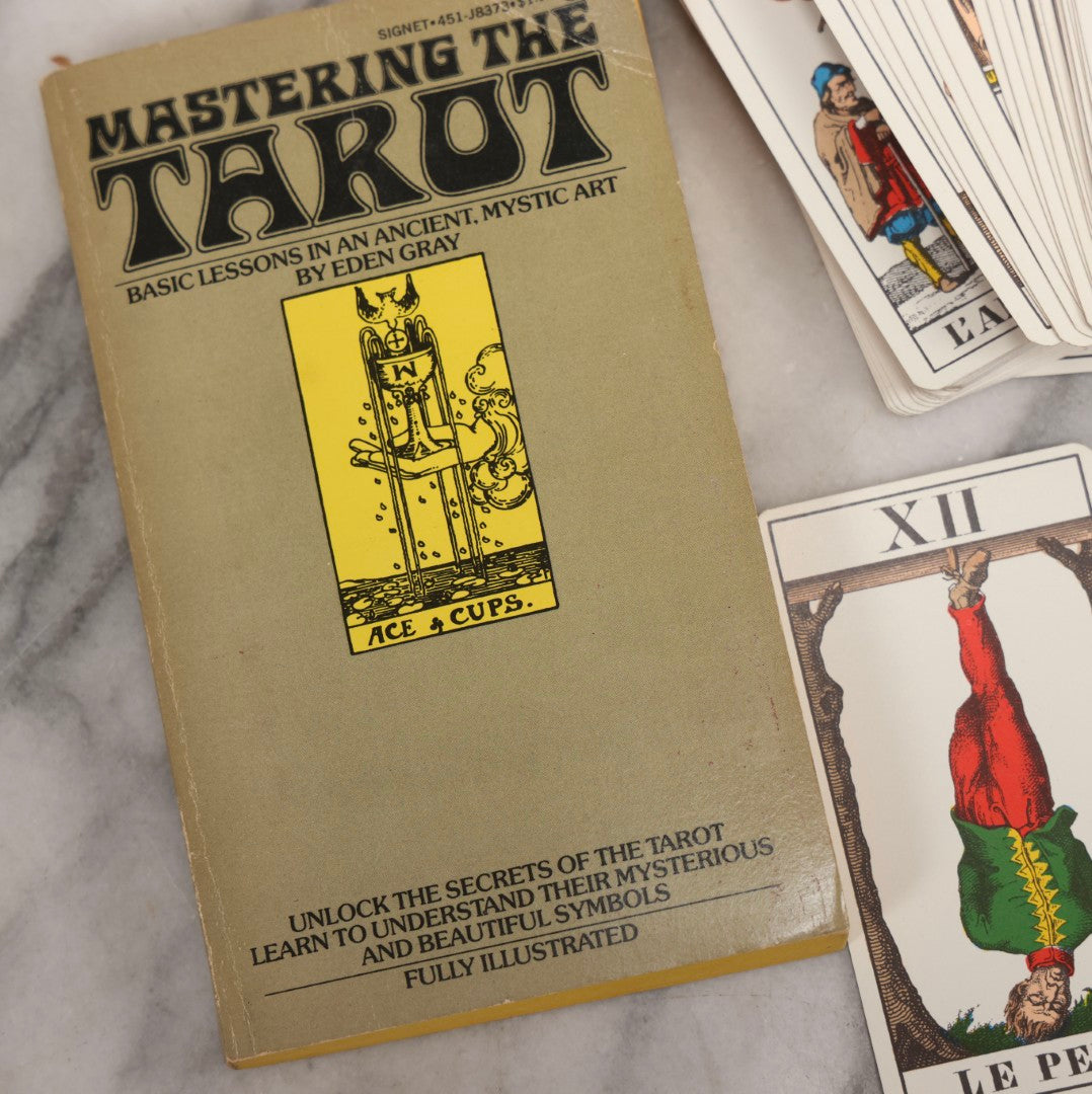 Lot 034 - Pair Of Vintage Tarot Items Including J. Muller & Cie French Marseille-Style Tarot Deck Of 78 Cards With Red Slip Case And "Mastering The Tarot" Paperback Book By Eden Gray, 1973