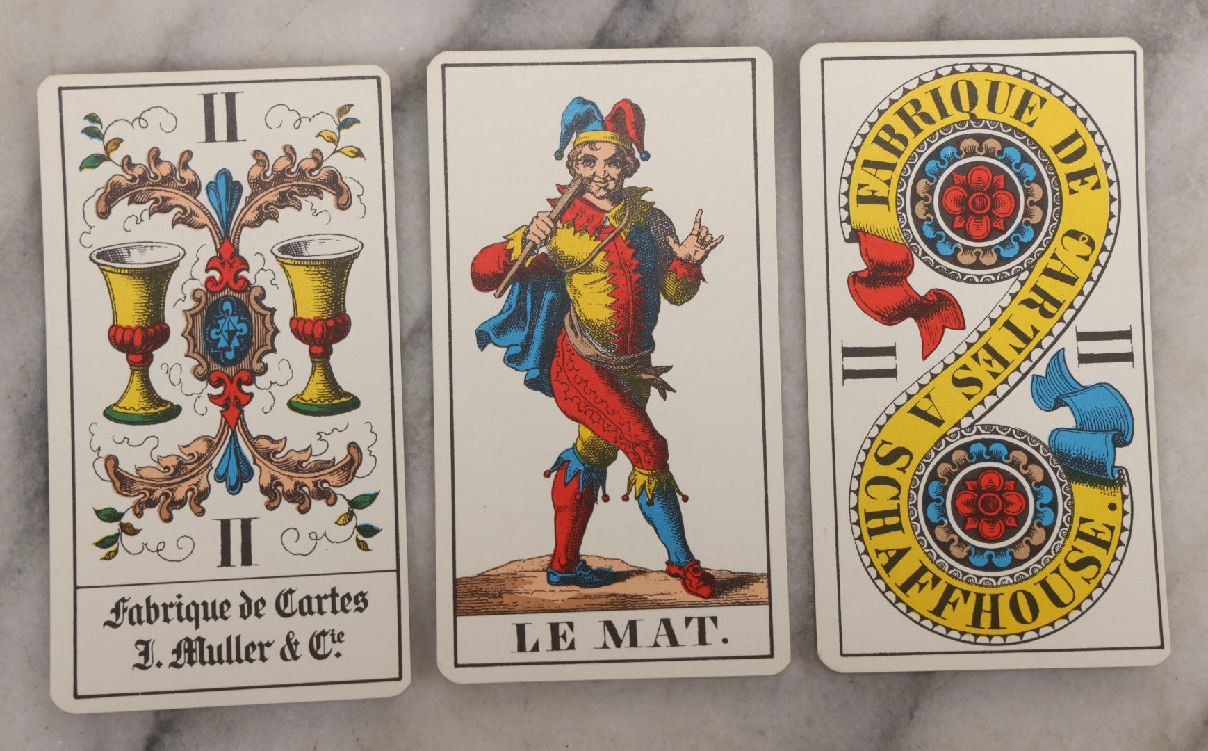 Lot 034 - Pair Of Vintage Tarot Items Including J. Muller & Cie French Marseille-Style Tarot Deck Of 78 Cards With Red Slip Case And "Mastering The Tarot" Paperback Book By Eden Gray, 1973