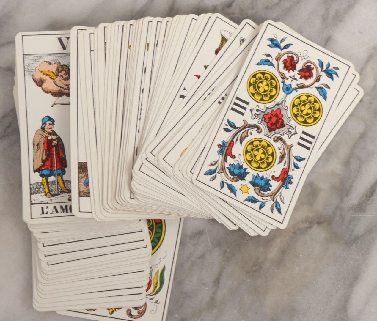 Lot 034 - Pair Of Vintage Tarot Items Including J. Muller & Cie French Marseille-Style Tarot Deck Of 78 Cards With Red Slip Case And "Mastering The Tarot" Paperback Book By Eden Gray, 1973