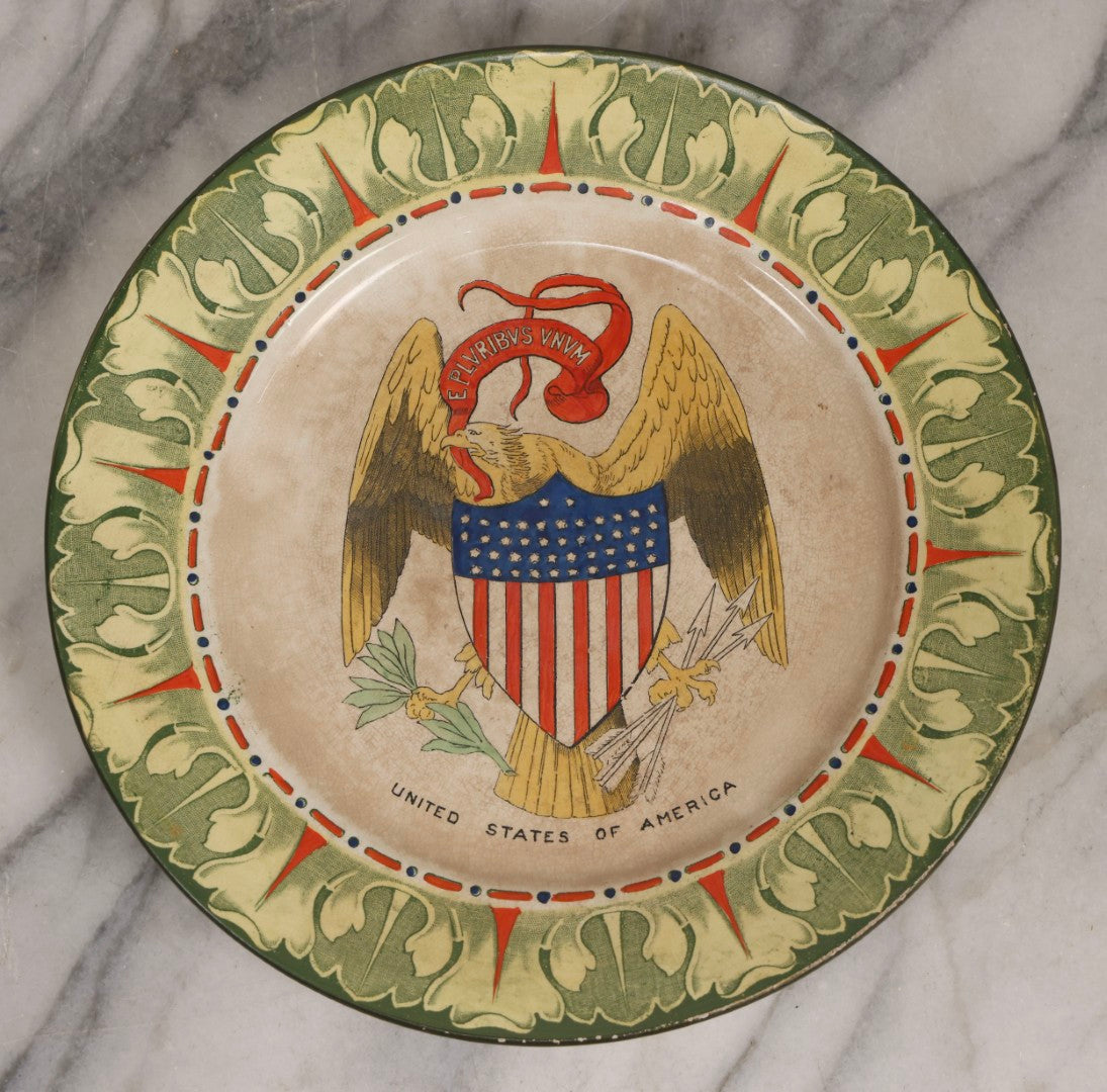 Lot 043 - Antique Hand Colored Transferware Pottery Patriotic Plate By Frank Beardmore & Co., Fenton, "National Emblems" Line With Bald Eagle, Patriotic Shield, And "E Pluribus Unum" Banner, 10" Diameter