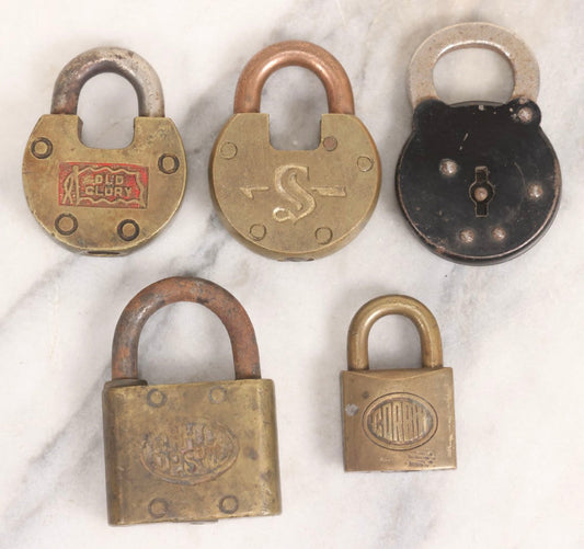 Lot 050 - Grouping Of Five Vintage And Antique Metal Padlocks With Assorted Cast Markings, Sold As Found Without Keys