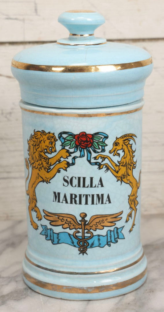Lot 052 - Vintage Mid Century Reproduction Porcelain Apothecary Jar “Scilla Maritima” (Drimia Maritima) With Blue Decoration, Gold Pin Striping, And Applied Lion Motif, Fantasy Item, Not Antique, 10-1/2" H