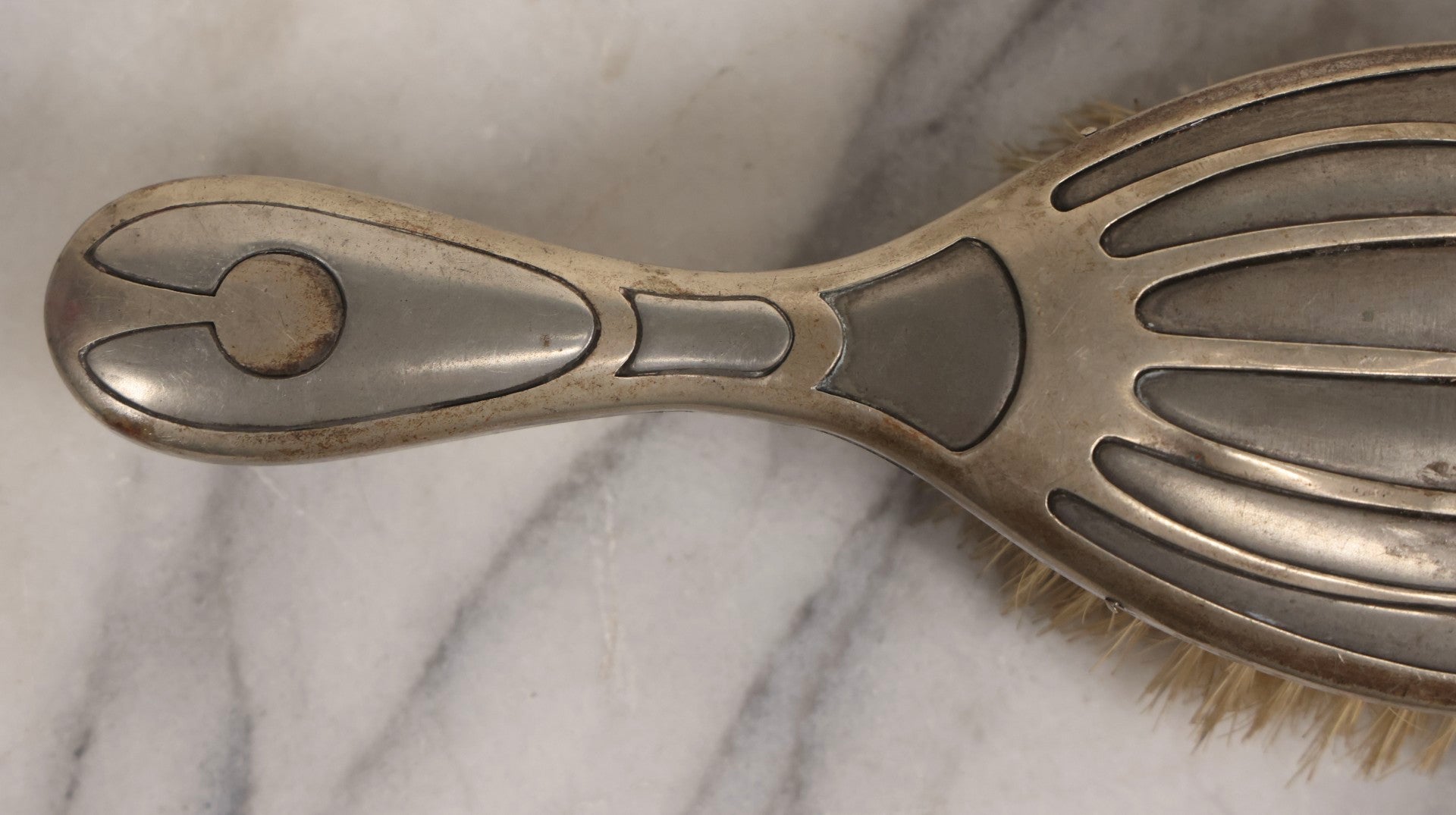 Lot 053 - Antique Art Deco Metal Clad Dresser Brush With Stylized Radiating Oval Motif, 9" L