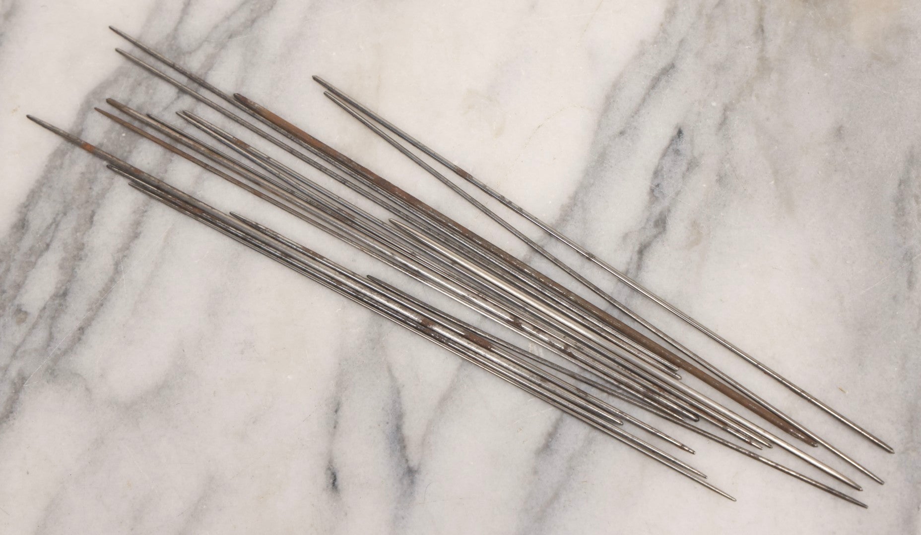 Lot 054 - Antique Gloria Brand Highly Tempered Steel Knitting Pins In Original Tin Lithograph Tube With Woman's Face Motif, Made In Germany, 9-3/4" L