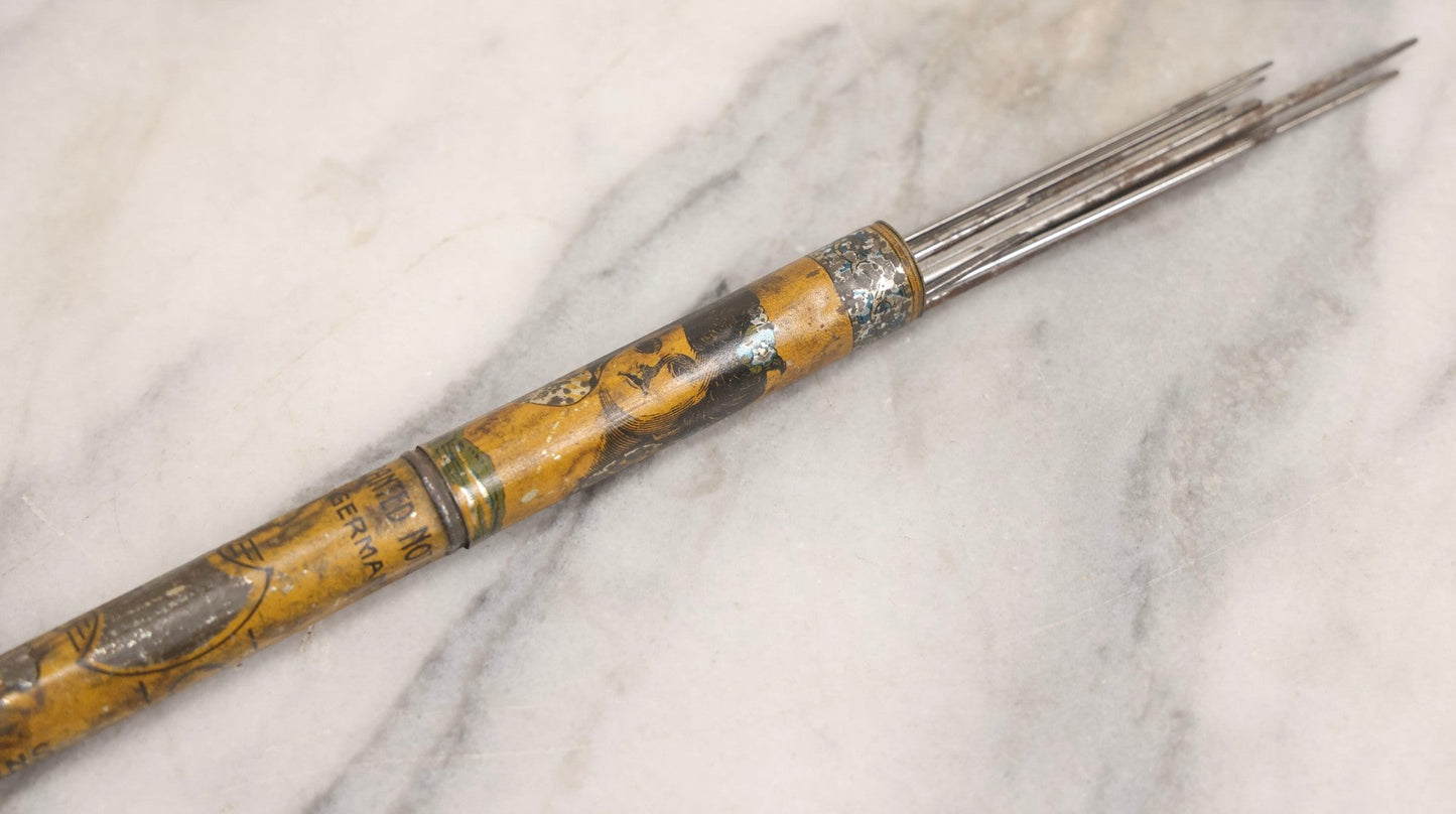 Lot 054 - Antique Gloria Brand Highly Tempered Steel Knitting Pins In Original Tin Lithograph Tube With Woman's Face Motif, Made In Germany, 9-3/4" L
