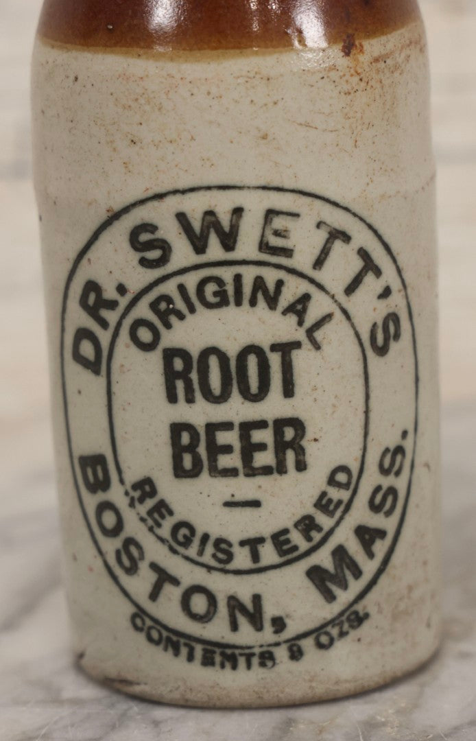 Lot 059 - Pair Of Antique Stoneware Soda Bottles For Dr. Swett's Original Root Beer, Boston, Massachusetts, 8 Fluid Ounces, 7-3/4" H Each