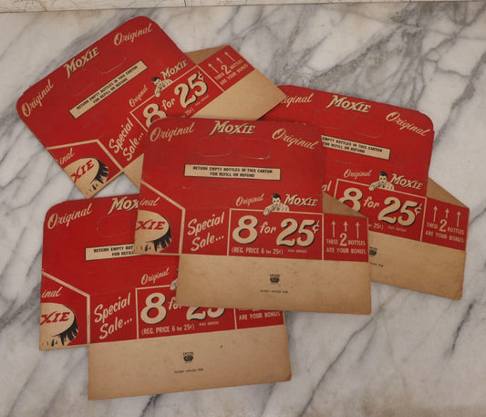 Lot 060 - Grouping Of Four Vintage New Old Stock N.O.S. Moxie Soda Pressboard 8-Pack Bottle Carriers, Empire Box Corporation, Garfield, New Jersey, Circa 1950