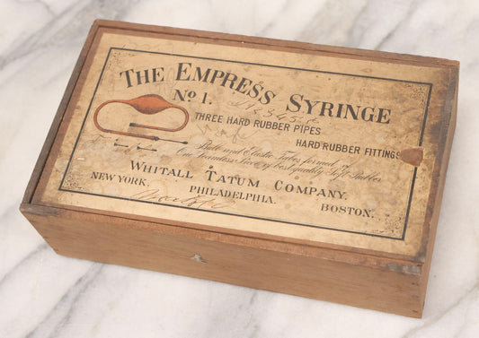 Lot 062 - Antique Wooden Slide-Top Box For The Empress Syringe No. 1 By Whitall Tatum Company With Paper Label, Stamped Germany