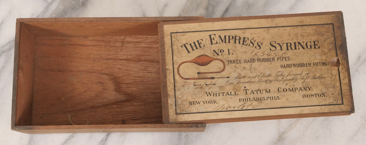 Lot 062 - Antique Wooden Slide-Top Box For The Empress Syringe No. 1 By Whitall Tatum Company With Paper Label, Stamped Germany
