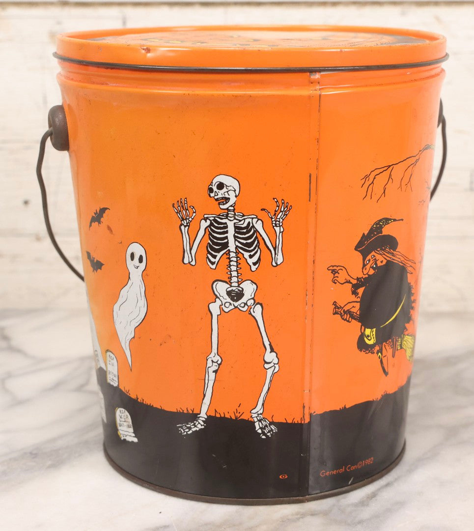 Lot 064 - Vintage Tin Lithograph Halloween Can Bucket With Ghosts, Skeleton, Witch, Jack-O-Lantern, And Haunted House, Copyright General Can Co. Inc., 1982, Montebello, California, 8-3/8" H
