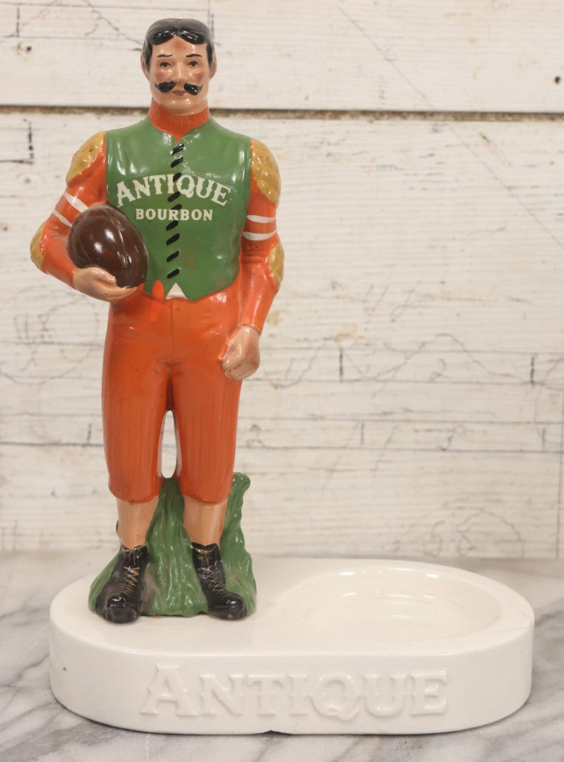 Lot 065 - Vintage Ceramic “Antique Bourbon” Advertising Ashtray With Standing Football Mascot, Japan, 10-3/4" H