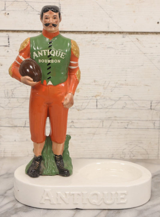 Lot 065 - Vintage Ceramic “Antique Bourbon” Advertising Ashtray With Standing Football Mascot, Japan, 10-3/4" H
