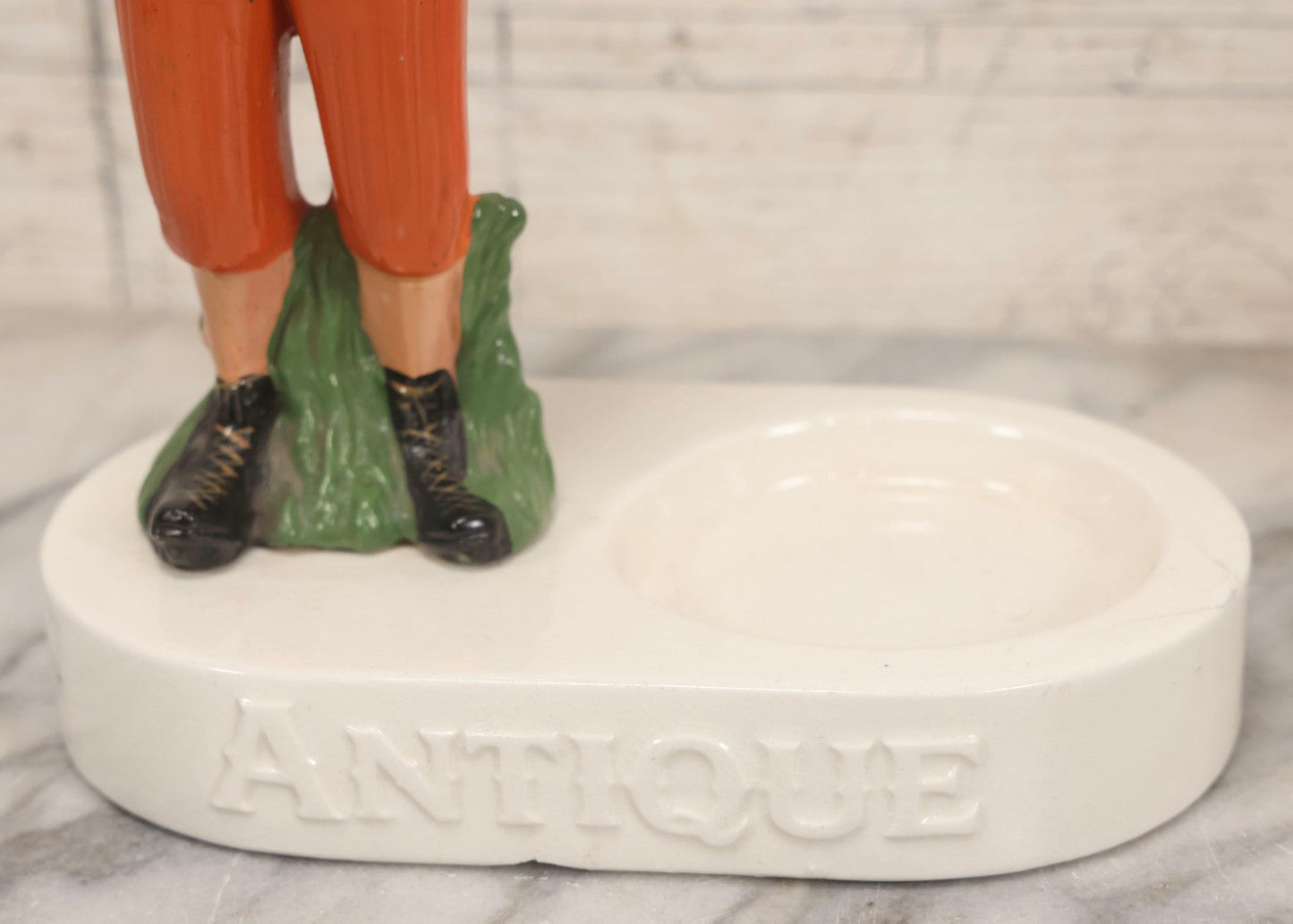 Lot 065 - Vintage Ceramic “Antique Bourbon” Advertising Ashtray With Standing Football Mascot, Japan, 10-3/4" H