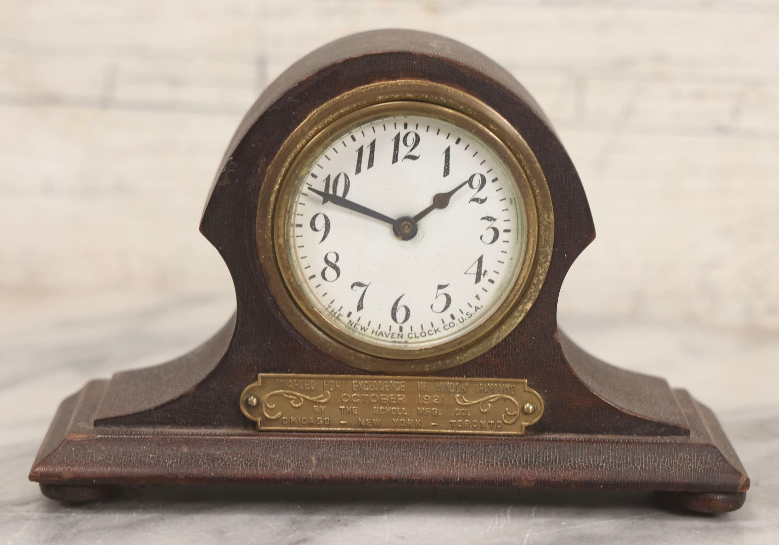 Lot 069 - Antique New Haven Clock Co. Tambour Mantel Clock Awarded For Excellence In Window Trimming, October 1921, The Scholl Mfg. Co., Untested, 3-1/2" H