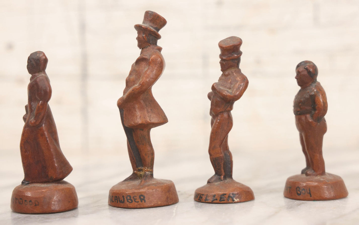 Lot 072 - Grouping Of Four Vintage Composition Charles Dickens Character Figurines By Bonnie Blink Studios, Winchester, Massachusetts, “Betsy Trotwood,” “The Fat Boy,” “Sam Weller,” And “Mr. Micawber," 2-1/2" To 3-1/2" H