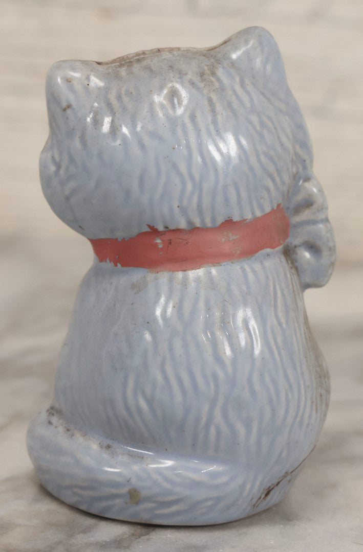 Lot 075 - Vintage Porcelain Hubley-Style Cat Still Bank With Blue Body, Red Eyes, And Red Bow, Note Damage, 4-1/2" H