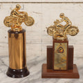 Lot 080 - Pair Of Vintage Motorcycle Trophies With Cast Metal Rider Finials, Including A.M.A. Badge And Buco Trophy