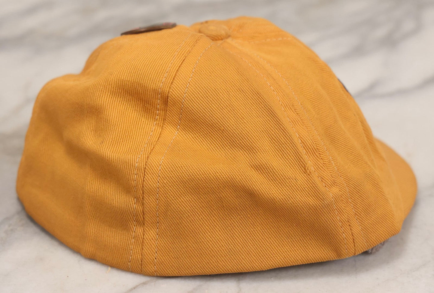 Lot 085 - Vintage Orange Cap With “65” Patch, E. Rosenstein Sons Label, And Two University Pins