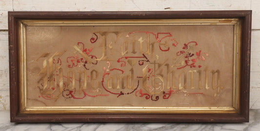 Lot 097 - Antique Victorian Punchwork Embroidery Motto “Faith, Hope, And Charity” In Deep Walnut Frame With Gold Inner Border, 23-1/4" x 10-3/4"