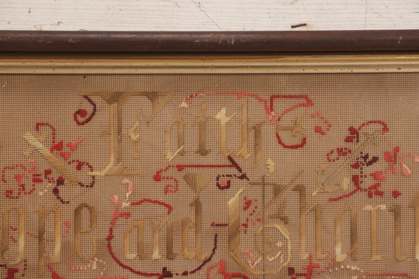 Lot 097 - Antique Victorian Punchwork Embroidery Motto “Faith, Hope, And Charity” In Deep Walnut Frame With Gold Inner Border, 23-1/4" x 10-3/4"