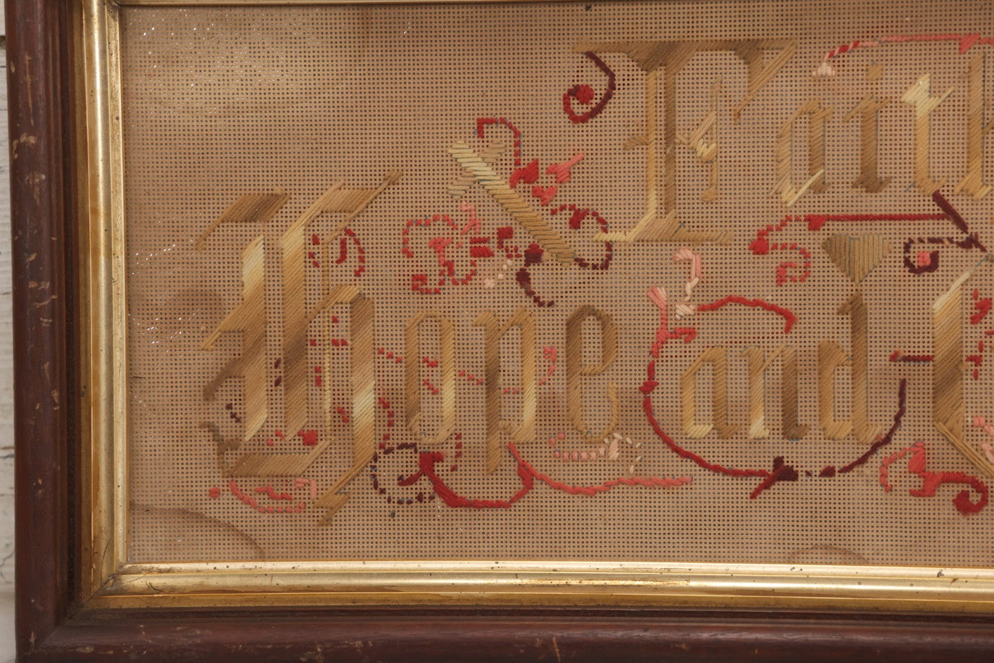 Lot 097 - Antique Victorian Punchwork Embroidery Motto “Faith, Hope, And Charity” In Deep Walnut Frame With Gold Inner Border, 23-1/4" x 10-3/4"
