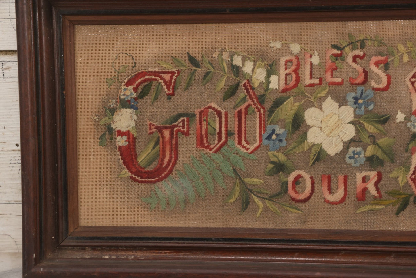 Lot 099 - Antique Victorian Punchwork Embroidery Motto “God Bless Our Home” In Deep Walnut Frame, 24-1/4" x 11-3/4"