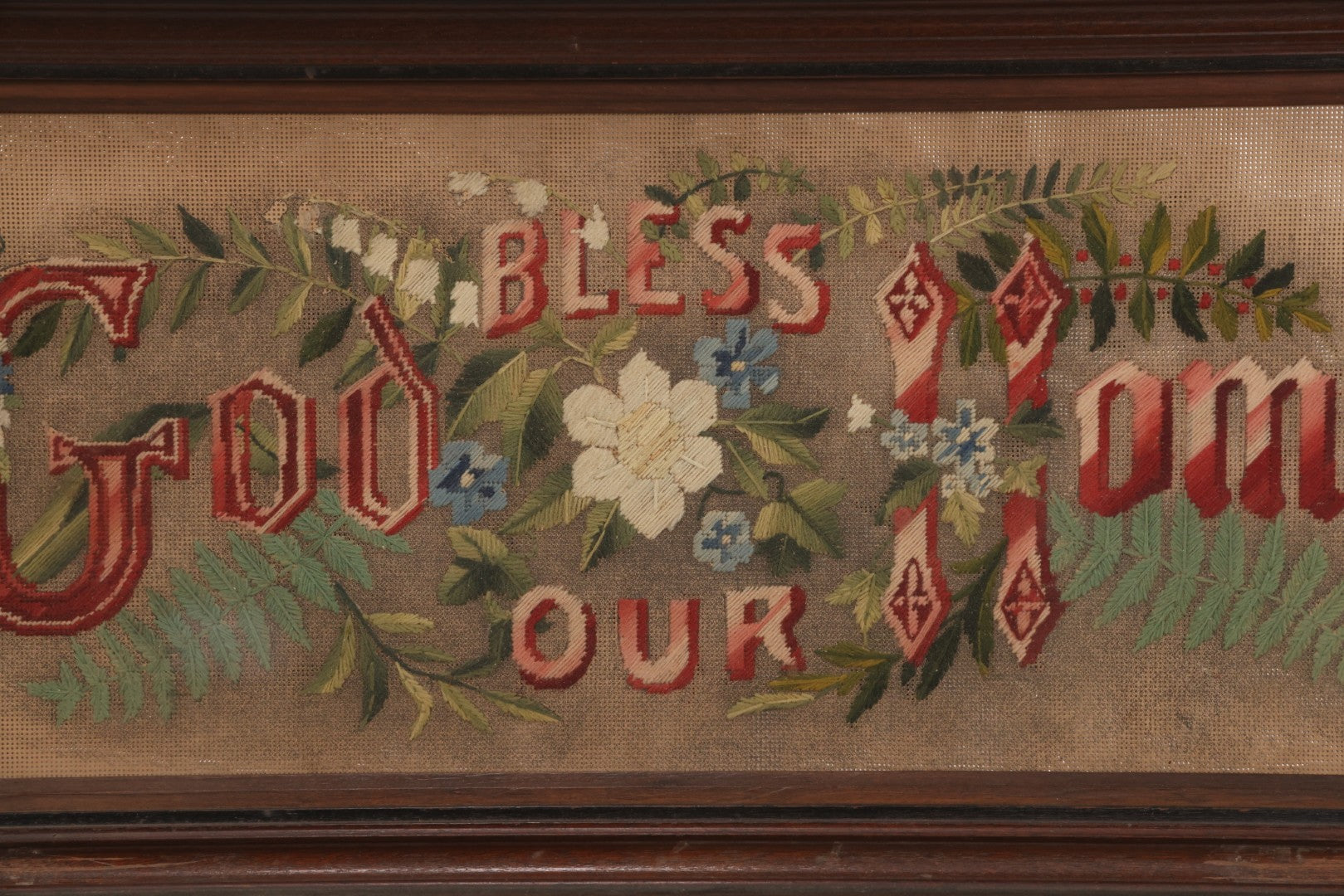 Lot 099 - Antique Victorian Punchwork Embroidery Motto “God Bless Our Home” In Deep Walnut Frame, 24-1/4" x 11-3/4"