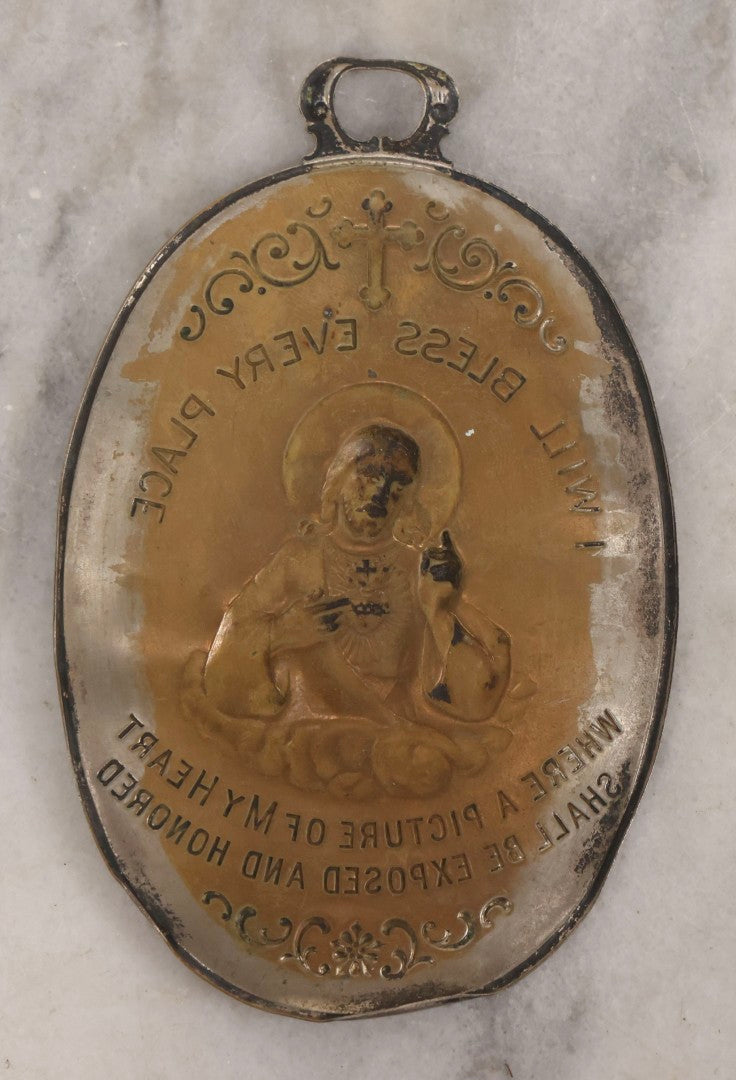 Lot 106 - Antique Pressed Brass Sacred Heart Wall Plaque With “I Will Bless Every Place” Inscription, 3-1/8" x 4-7/8"