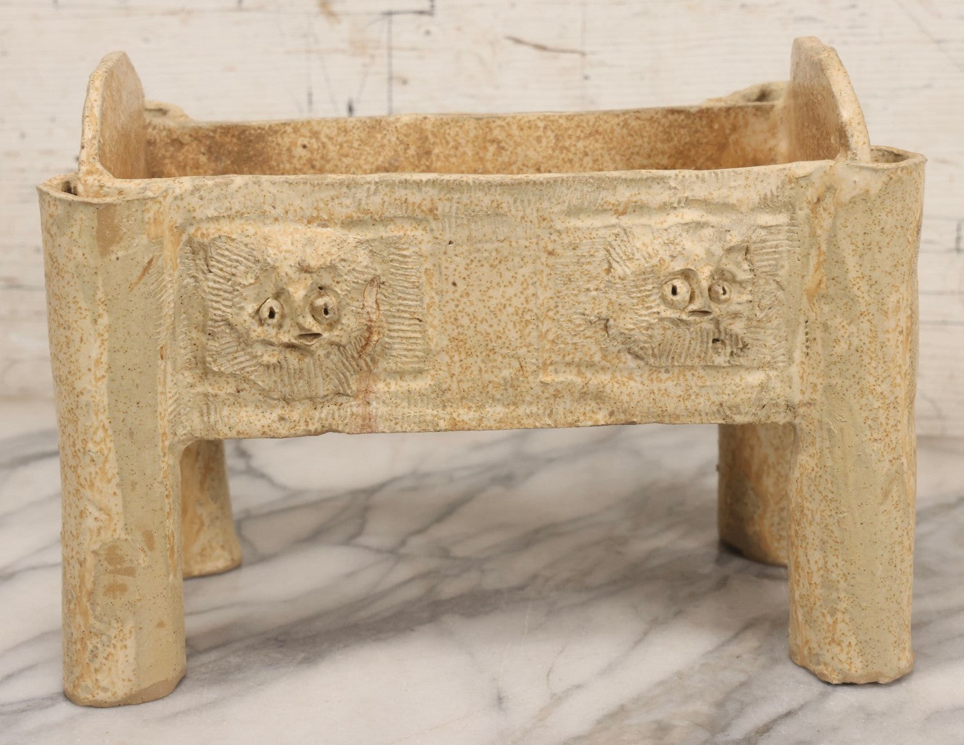 Lot 108 - Vintage Pre-Columbian Style Replica Hand Built Four-Legged Pottery Planter With Appliqué Face Masks, 11-3/4" L