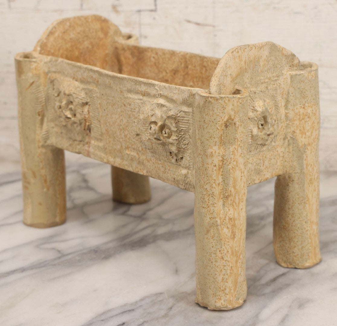 Lot 108 - Vintage Pre-Columbian Style Replica Hand Built Four-Legged Pottery Planter With Appliqué Face Masks, 11-3/4" L