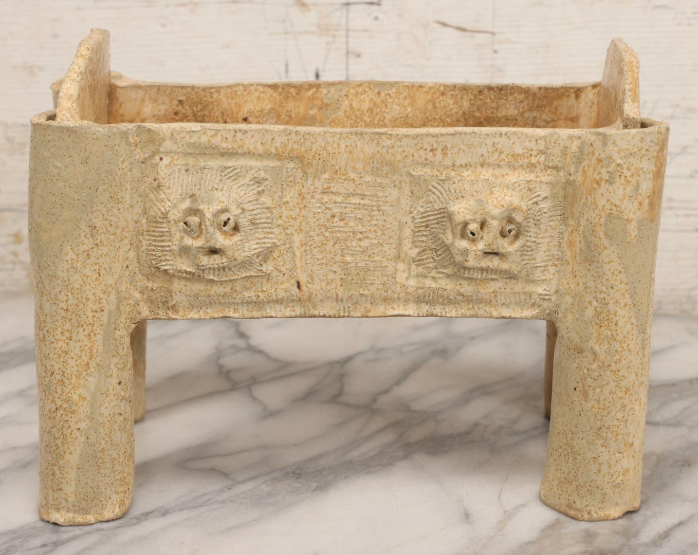 Lot 108 - Vintage Pre-Columbian Style Replica Hand Built Four-Legged Pottery Planter With Appliqué Face Masks, 11-3/4" L