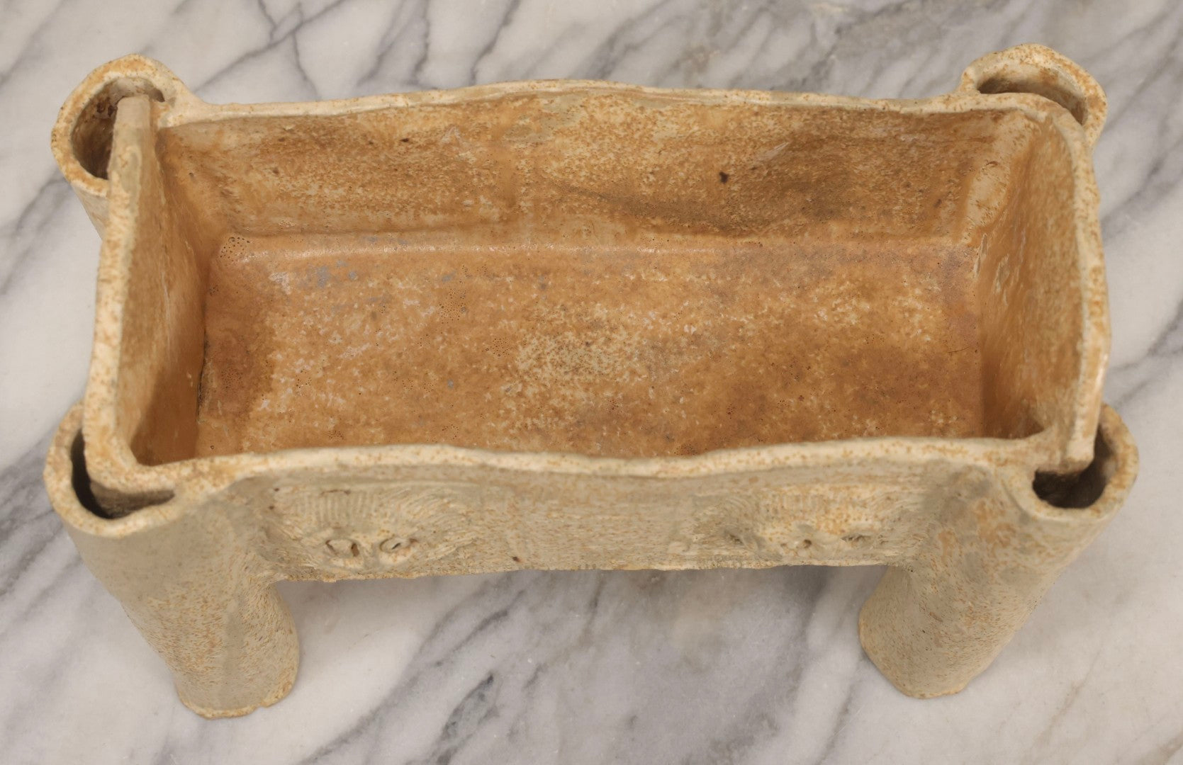 Lot 108 - Vintage Pre-Columbian Style Replica Hand Built Four-Legged Pottery Planter With Appliqué Face Masks, 11-3/4" L