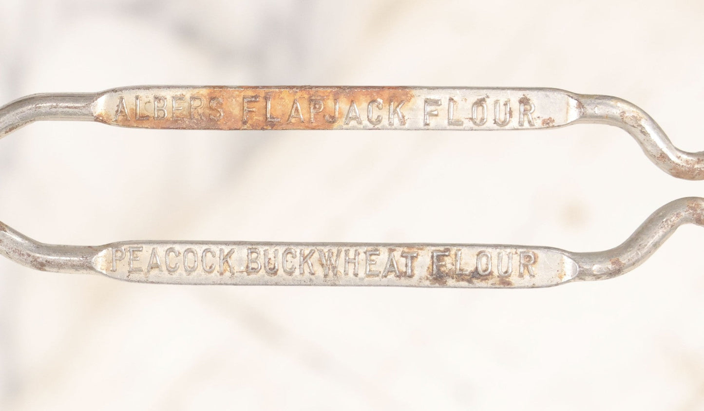 Lot 114 - Vintage Steel Advertising Spatula For Albers Flapjack Flour And Peacock Buckwheat Flour, Patented, With Heart Cutout, 11-1/8" L