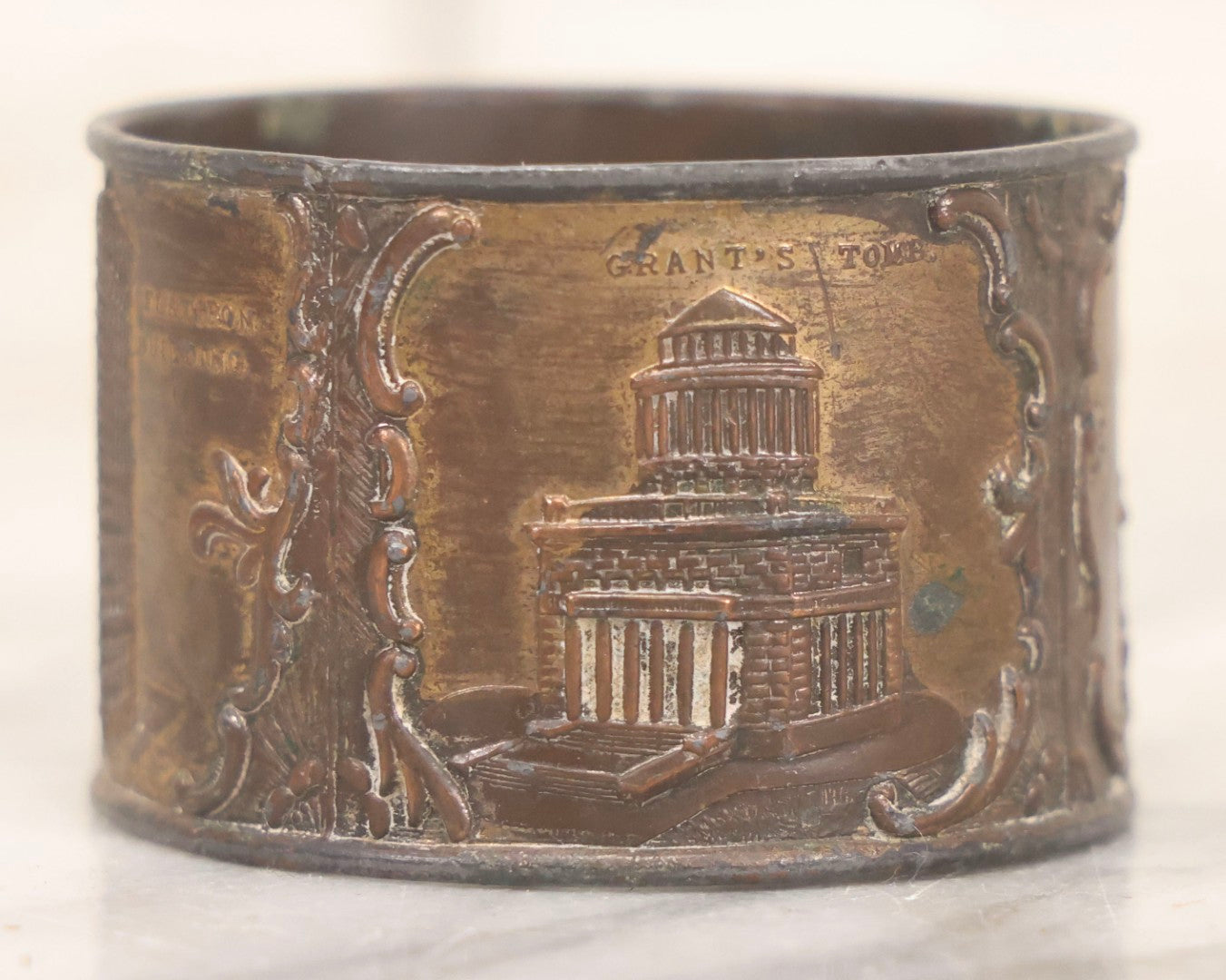 Lot 118 - Antique Pot Metal Souvenir Napkin Ring Featuring New York City Landmarks Including Statue Of Liberty, Grant's Tomb And Flatiron Building