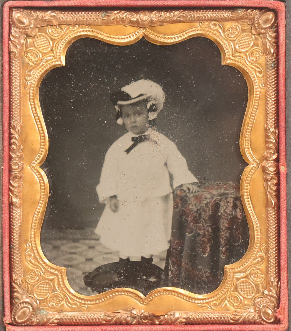 Lot 128 - Antique 1/6th Plate Ambrotype Photograph Of Young Child In White Dress And Feathered Hat, In Half Leatherette Union Case