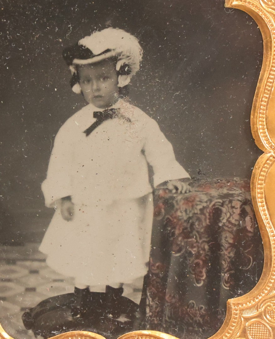Lot 128 - Antique 1/6th Plate Ambrotype Photograph Of Young Child In White Dress And Feathered Hat, In Half Leatherette Union Case