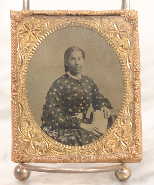 Lot 130 - Antique 1/6th Plate Tintype Photograph Of Seated Woman Holding Book, With Brass Mat And Preserver, No Case
