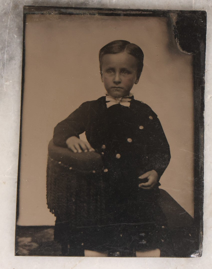 Lot 135 - Grouping Of Nine Antique Tintype Photographs Including Ladies With Parasol, Man In Bowler Hat, Group Portrait, And Child In Miniature Wood Frame