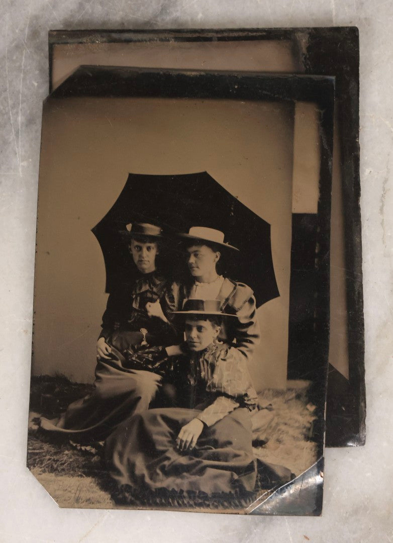 Lot 135 - Grouping Of Nine Antique Tintype Photographs Including Ladies With Parasol, Man In Bowler Hat, Group Portrait, And Child In Miniature Wood Frame
