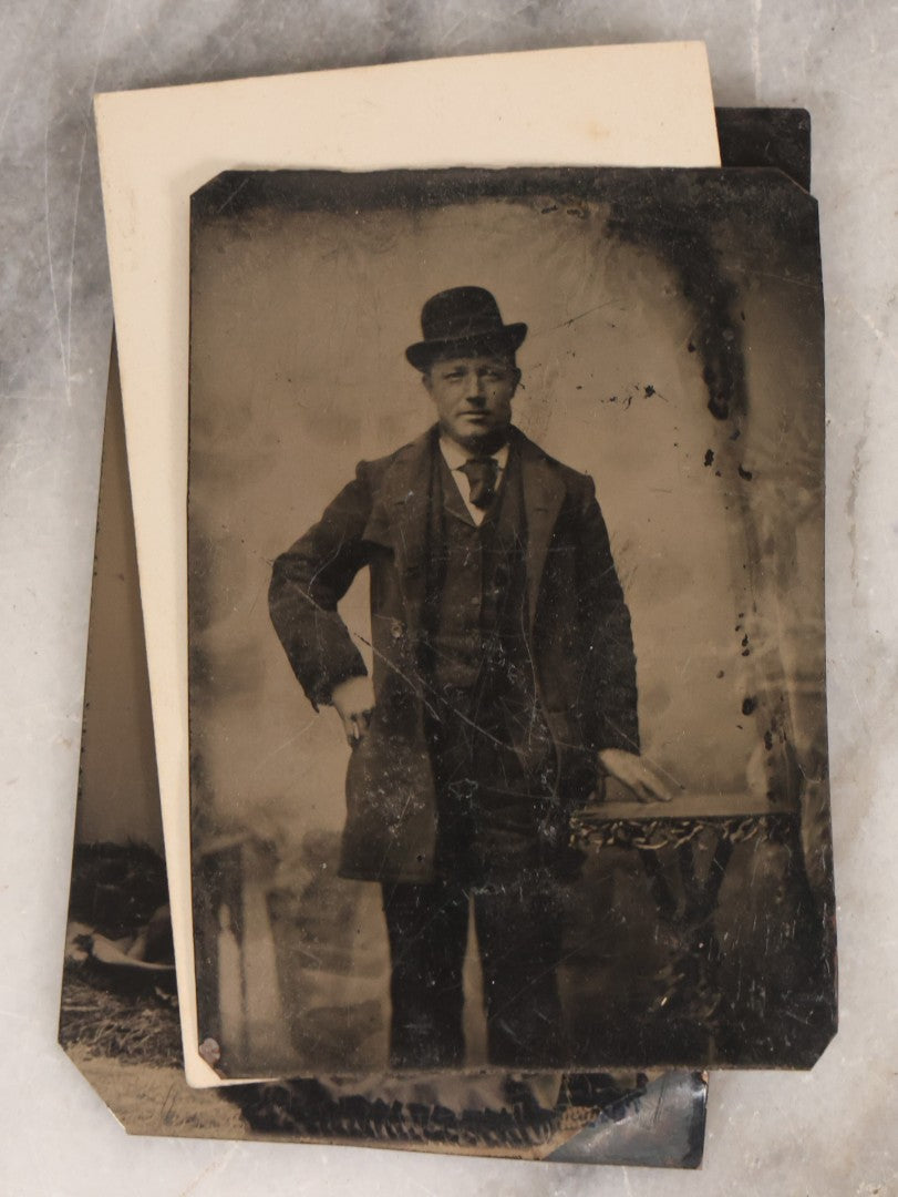 Lot 135 - Grouping Of Nine Antique Tintype Photographs Including Ladies With Parasol, Man In Bowler Hat, Group Portrait, And Child In Miniature Wood Frame