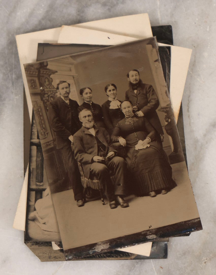 Lot 135 - Grouping Of Nine Antique Tintype Photographs Including Ladies With Parasol, Man In Bowler Hat, Group Portrait, And Child In Miniature Wood Frame