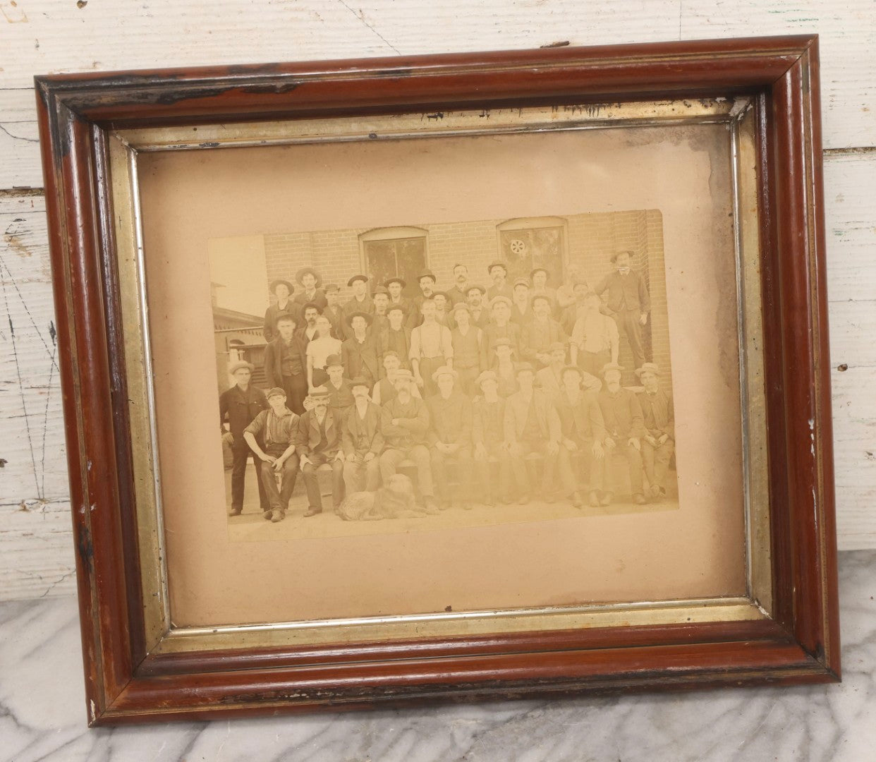 Lot 137 - Antique Occupational Boarded Photograph Of Factory Workers With Dog In Deep Walnut Frame, Circa 1880–1890, 13-1/2" x 11-1/2"