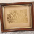 Lot 137 - Antique Occupational Boarded Photograph Of Factory Workers With Dog In Deep Walnut Frame, Circa 1880–1890, 13-1/2" x 11-1/2"