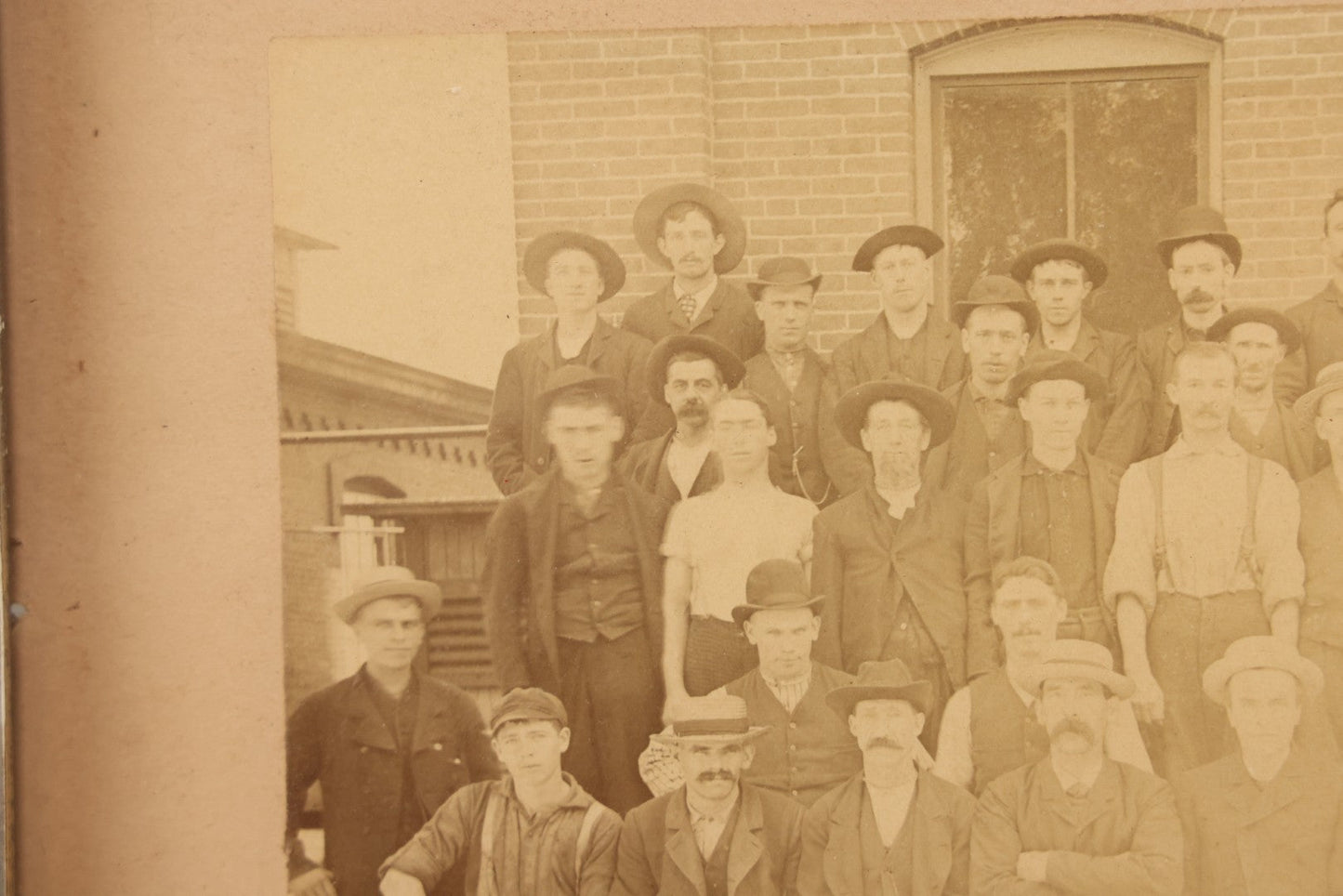 Lot 137 - Antique Occupational Boarded Photograph Of Factory Workers With Dog In Deep Walnut Frame, Circa 1880–1890, 13-1/2" x 11-1/2"